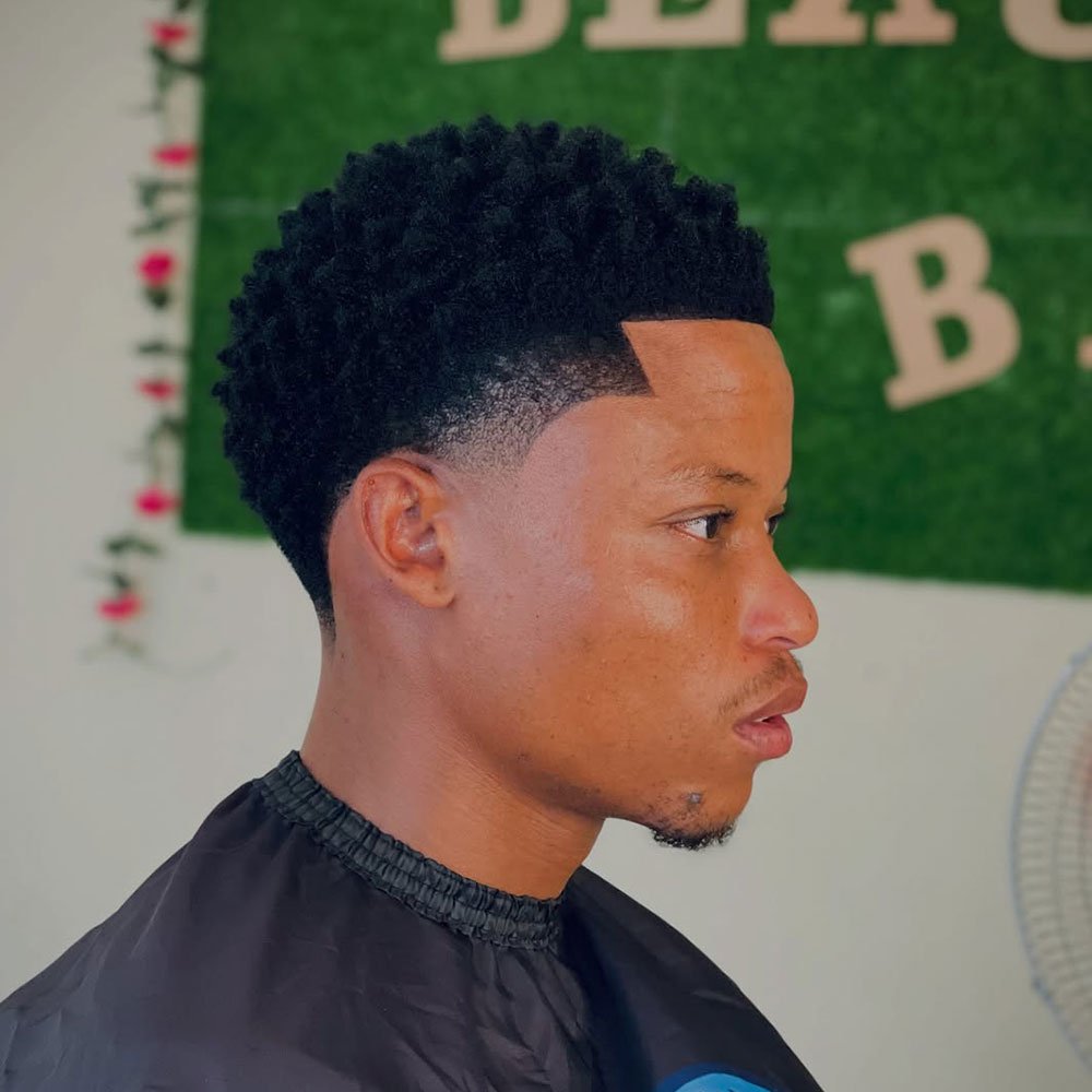 Low Taper Fade with Defined Afro and Sharp Line-Up