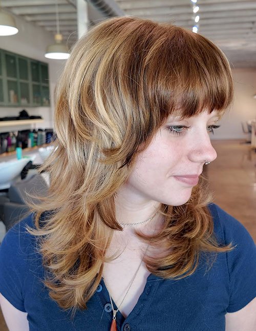 Feathered Medium Shag Haircut with Full Fringe
