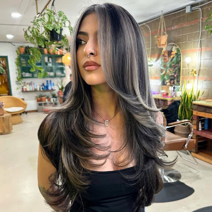 Ash brown balayage hairstyle with soft waves.
