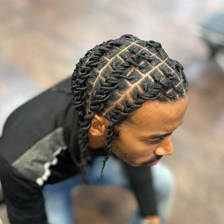Neat barrel twists in a cornrow pattern with clean grid parting.