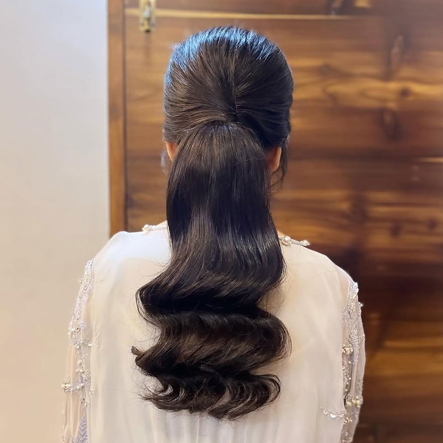 Elegant classic ponytail hairstyle with smooth waves