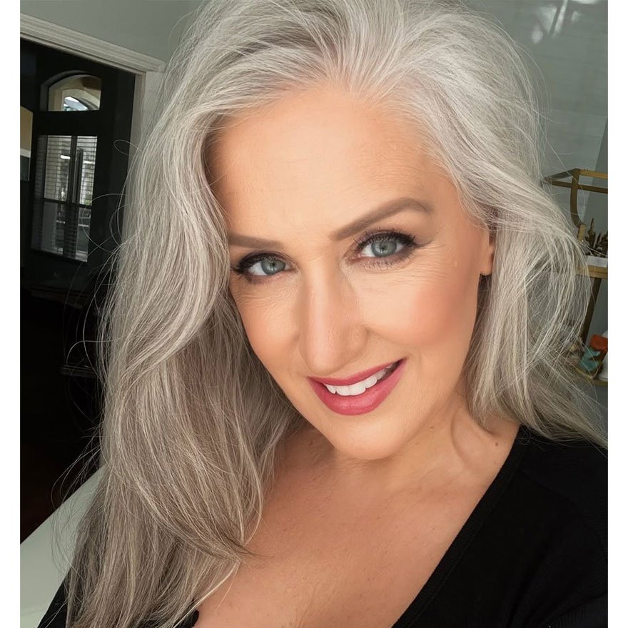 Silver ash gray hair color on woman with waves.