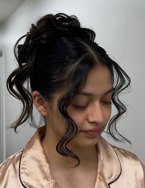 Soft face-framing curly prom updo