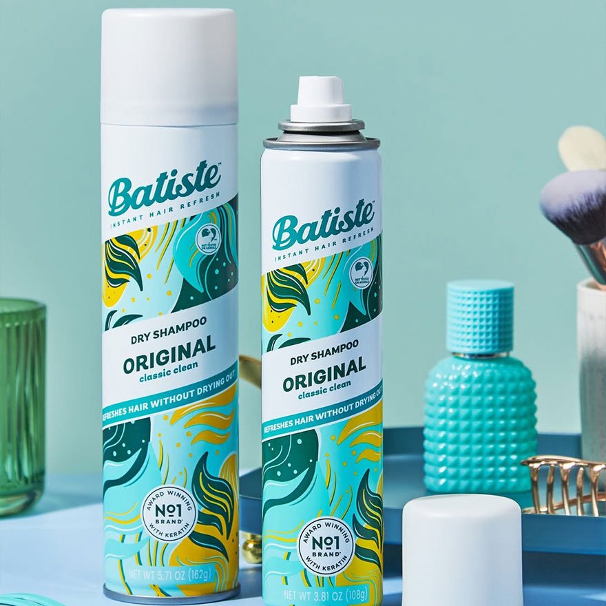Batiste Original dry shampoo bottles arranged together on a light background