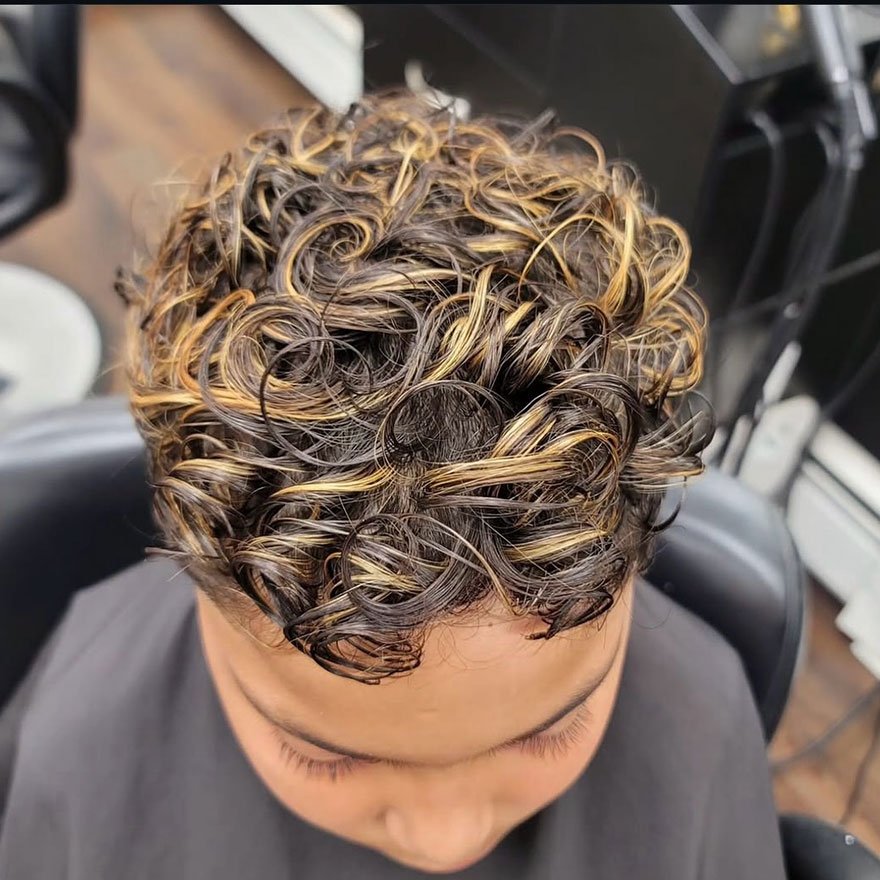 Curly blonde highlights hairstyle for men