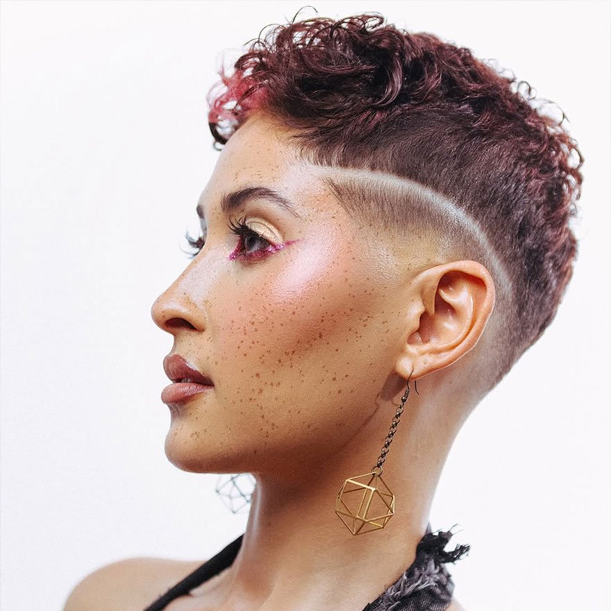 Shaved-side pixie cut with tight fade.