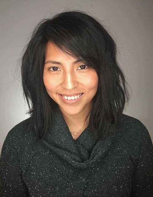 Medium-length textured shag with side-swept bangs