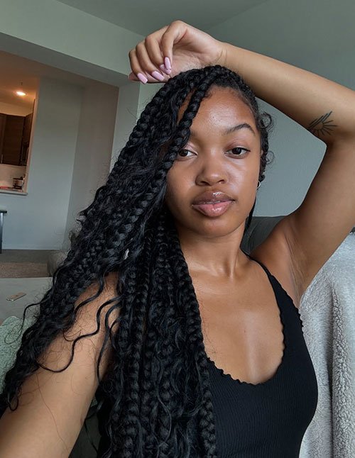 side part feed in cornrows with curly lengths protective style