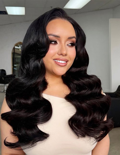 Hollywood glam waves hairstyle with deep, glossy old-Hollywood curls.