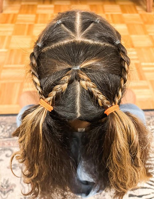 Classic center part braided pigtails hairstyle