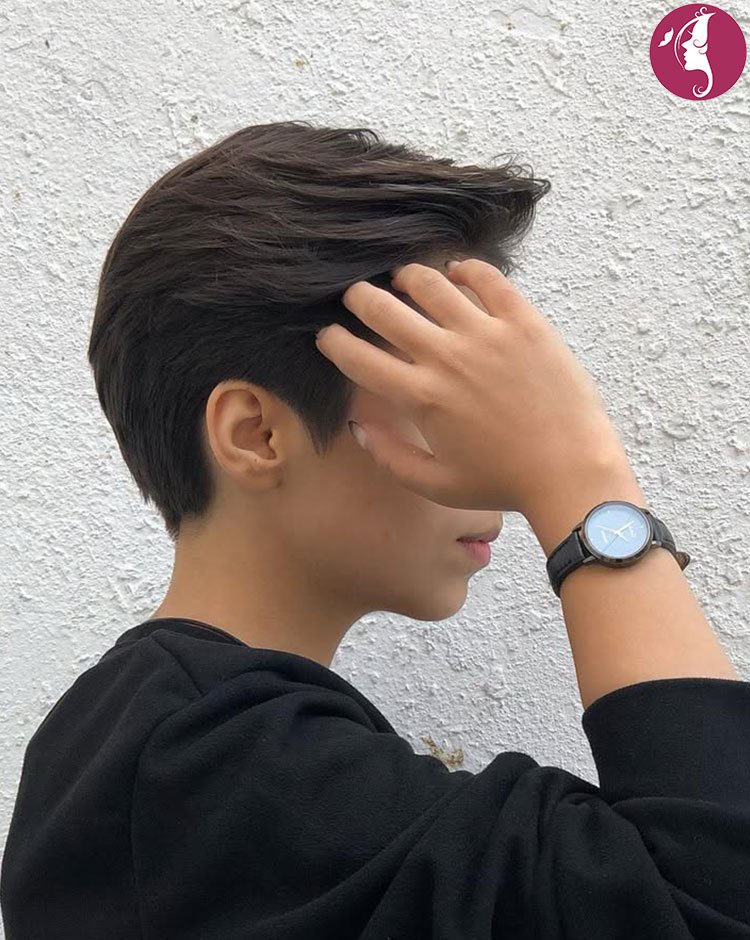 Classic tapered tomboy pixie haircut with short sides and textured top