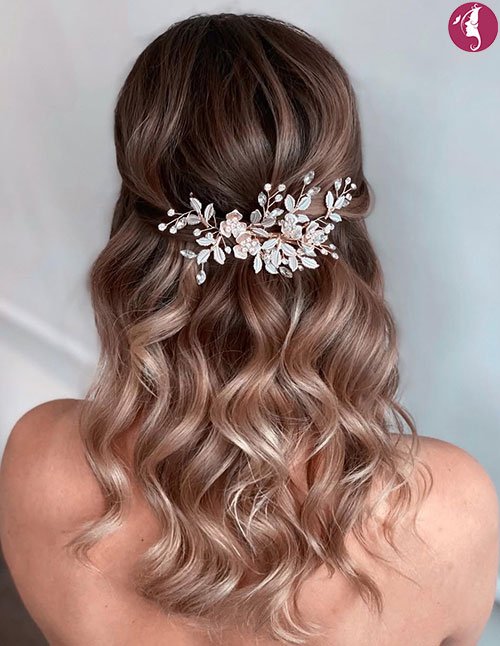 Elegant half-up twist hairstyle with loose curls