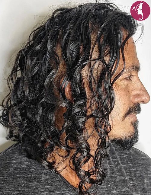Long curly layered haircut for men side profile portrait
