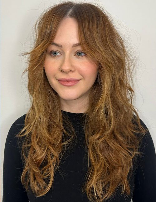 Long layered haircut on medium-length hair with soft face-framing layers