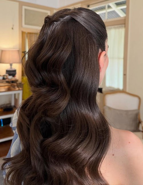 Romantic half-up half-down hairstyle with soft waves