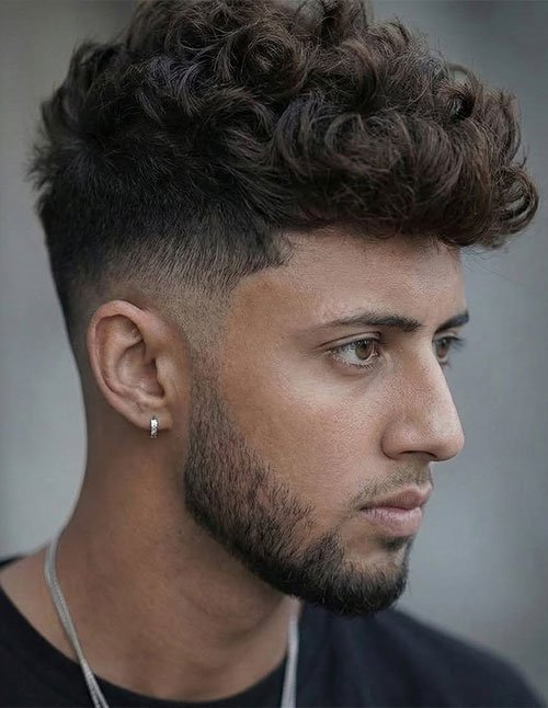 Curly textured crop fade haircut