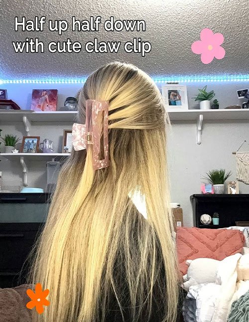 Half-up half-down hairstyle secured with a claw clip