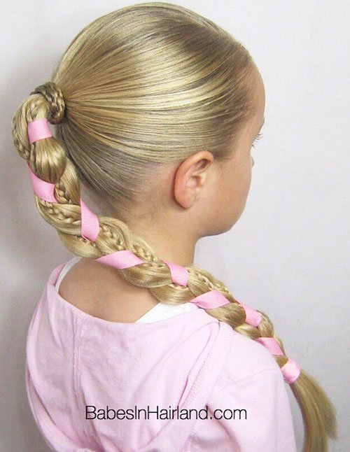 Blonde side braid wrapped with pink ribbon
