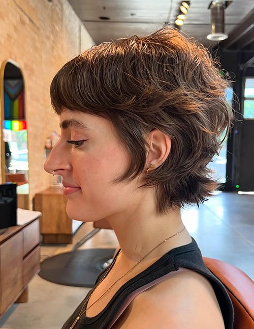 Soft shaggy androgynous pixie with feathered layers