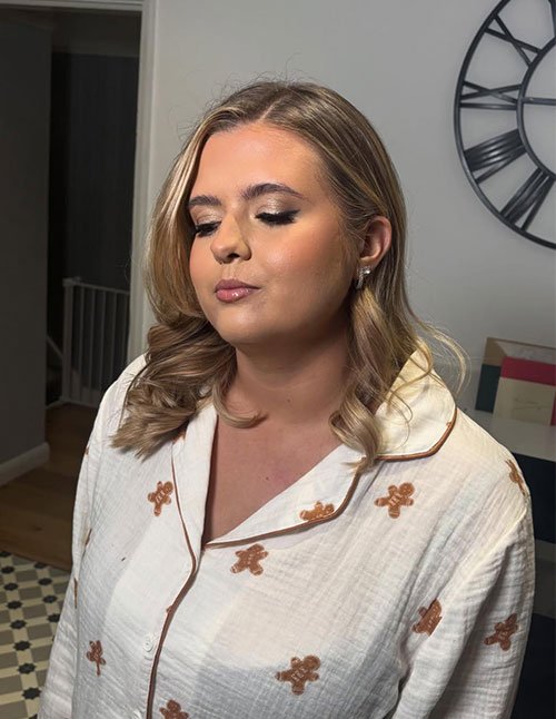 Chic Prom Hair Short with a side-part and soft, polished waves on shoulder-length hair.