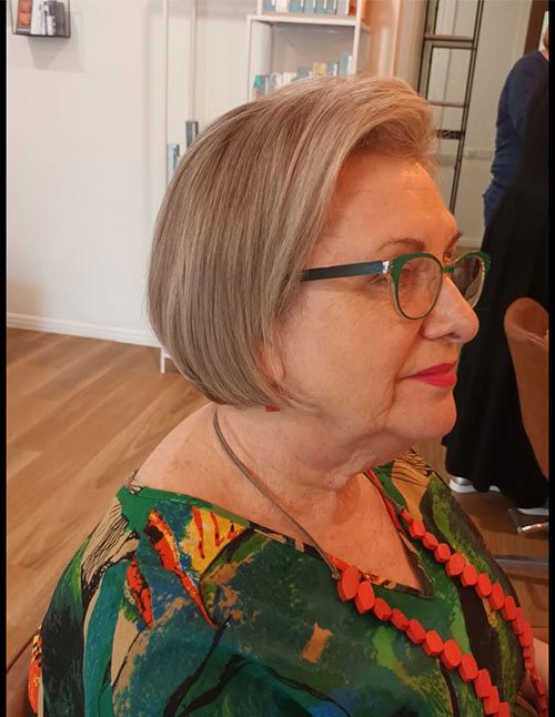 Classic short bob with smooth finish and soft side part