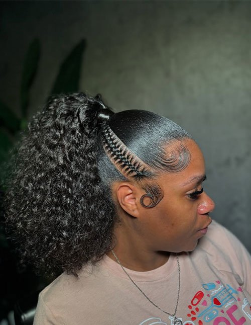 Side view of a sleek high ponytail with a full curly pony and a braided side section.