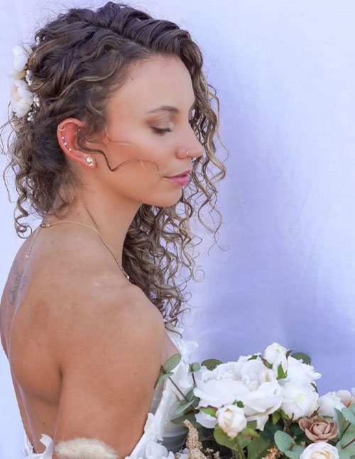 Elegant half-up wedding curls with soft face-framing tendrils