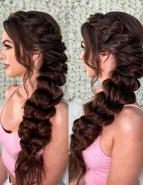 Romantic voluminous side braid with loose face-framing strands on brunette hair.