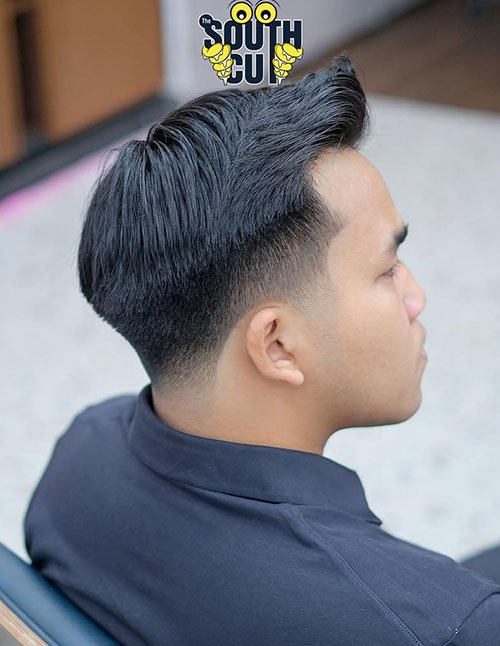 Side Part Taper haircut with a clean side part, smooth taper on the sides, and neatly styled top.