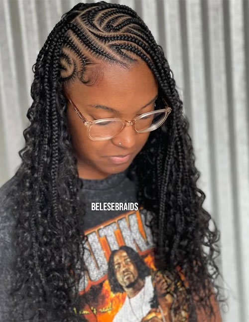 Side-part feed-in braids with loose curls and wavy lengths.