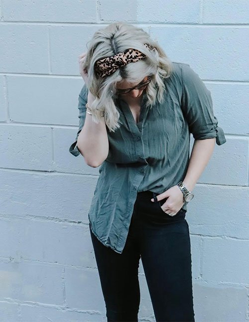 Simple short hairstyle styled with a patterned headband and loose waves.