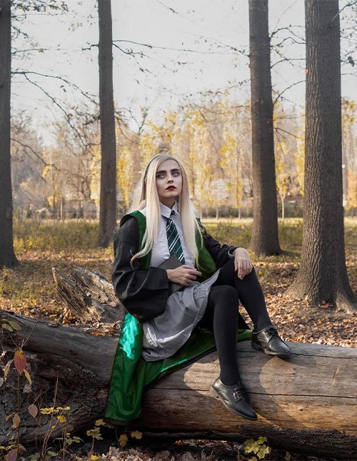 Slytherin aesthetic hair look with long, sleek, straight platinum-blonde hair, styled smooth and polished.