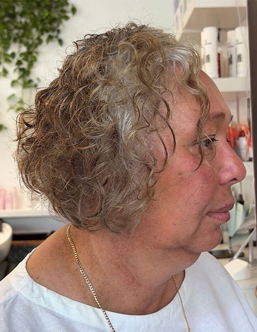 Soft volumized curls on short layered haircut with natural texture