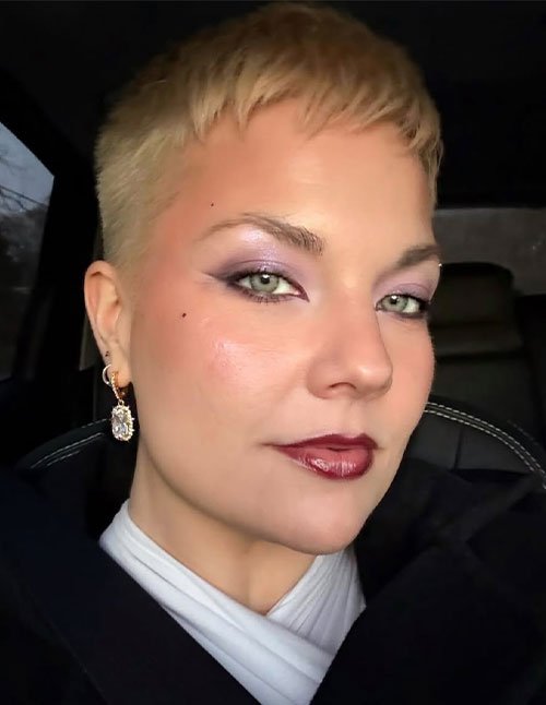 Textured crop haircut with short blonde top and faded sides