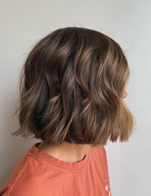 Tousled Bob Hairstyle with soft messy waves and chin-length blunt ends