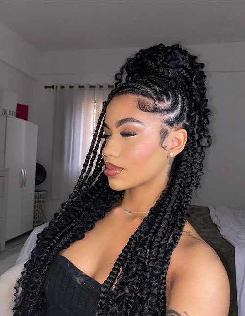 Trendy baddie braids styled into a high curly ponytail with sleek cornrow details and defined loose curls.