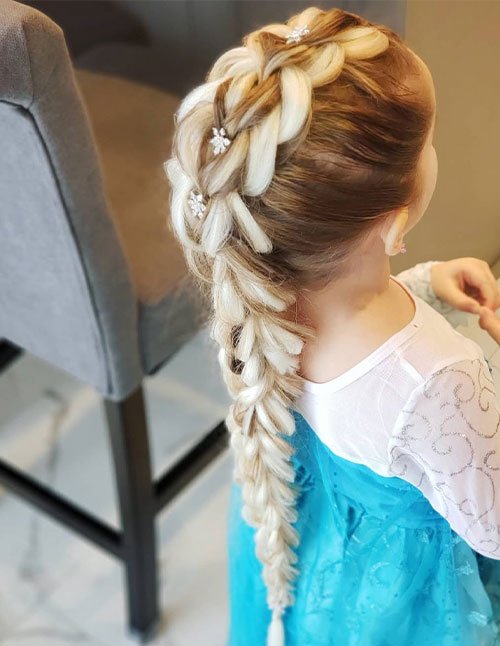 Elsa-inspired chunky braid with crystal clips, styled into a long, voluminous plait.
